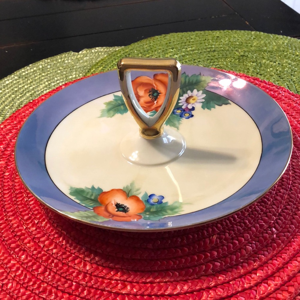 Noritake round serving dish with handle.